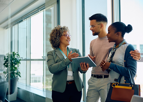 team member talking to clients